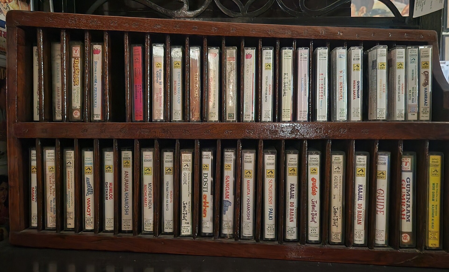 Wooden rack filled with audio cassettes