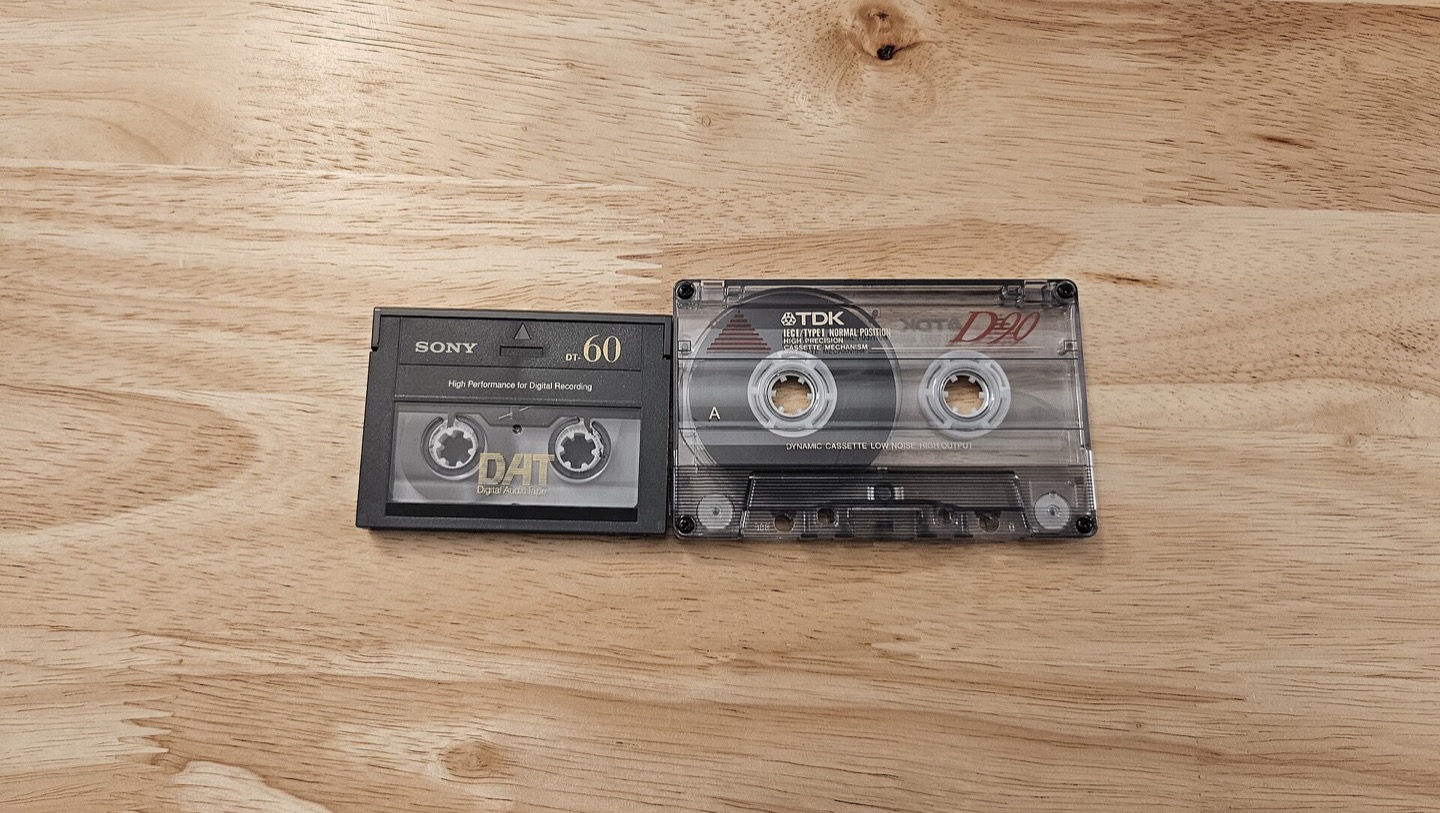 Compact cassette shown beside a DAT cassette